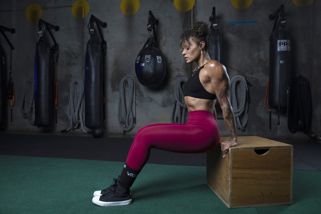 A girl working out in a gym.